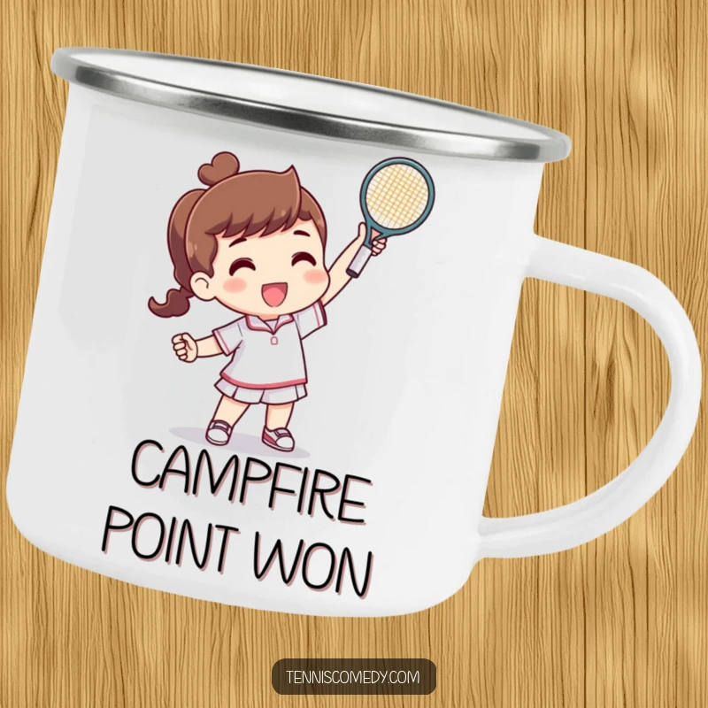 Funny camping mug showing a character triumphantly raising a tiny tennis racquet after a successful point, ideal for outdoor tennis humor.