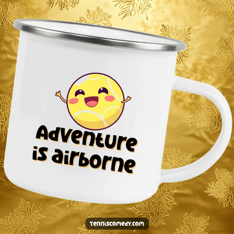 Funny tennis ball camping mug showing a smiling tennis ball joyfully bouncing high in the air, perfect for adventurers.