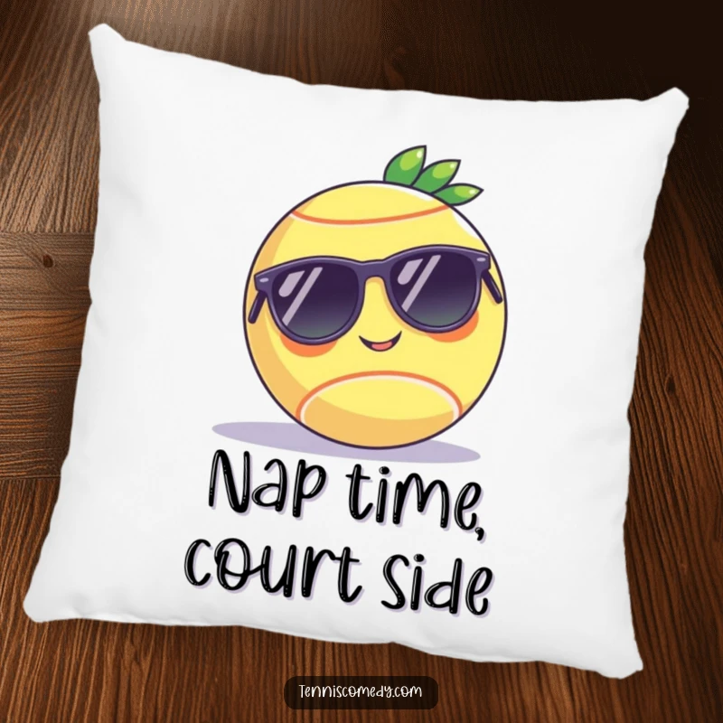 Funny pillow featuring a tennis ball with sunglasses relaxing on a court, offering comfort and humor as a delightful gift.
