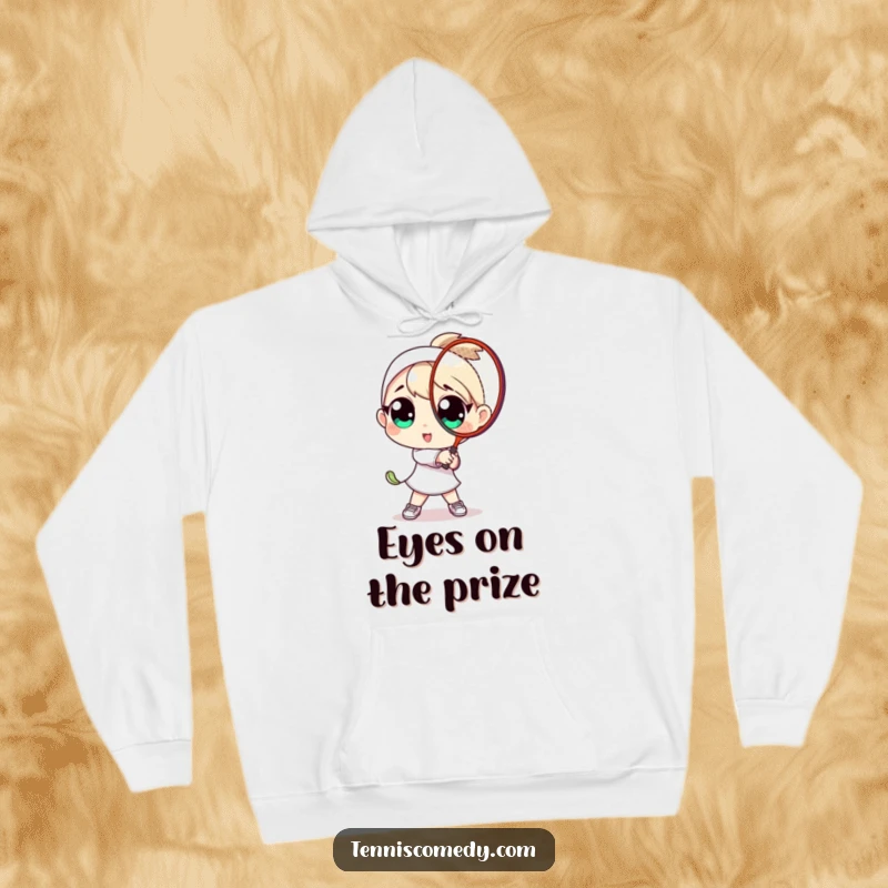 Funny hoodie design: a character with oversized eyes playfully mid-swing with a tennis racket. Comfortable and amusing.