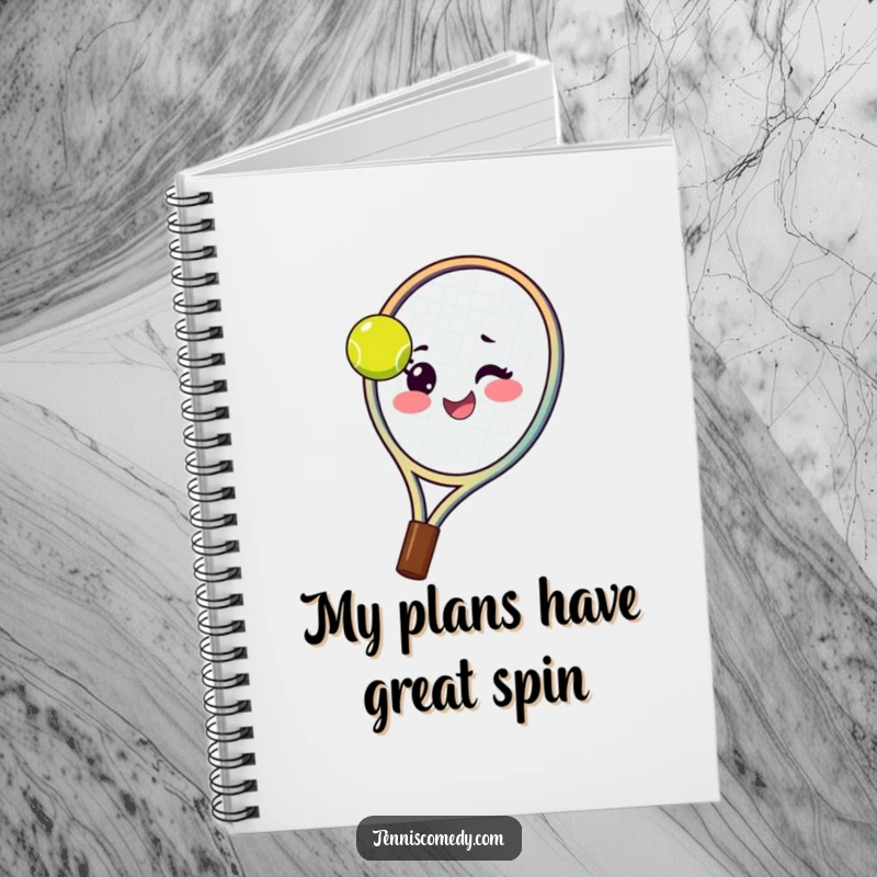 Funny tennis racket notebook with a happy racket spinning a tennis ball on its strings with a wink, ideal for jotting ideas.